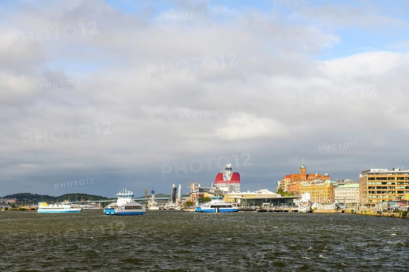 View of Gothenburg harbour with boats and municipal buildings under cloudy sky, Gothenburg, Västra Götalands län, Sweden