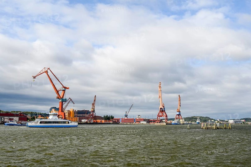 Industrial port on Götaälv in Gothenburg with several large cranes on the riverbank, Gothenburg, Västra Götalands län, Sweden