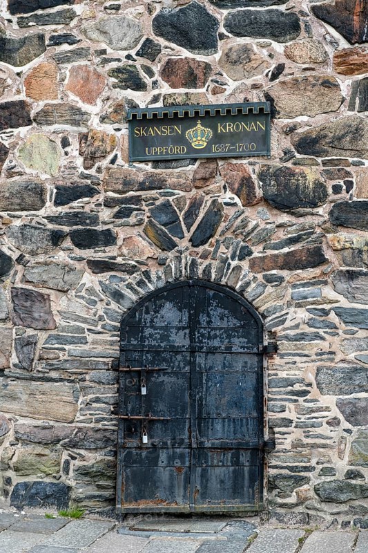 Iron door in old stone wall with Skansen Kronan sign, Gothenburg, Västra Götalands län, Sweden