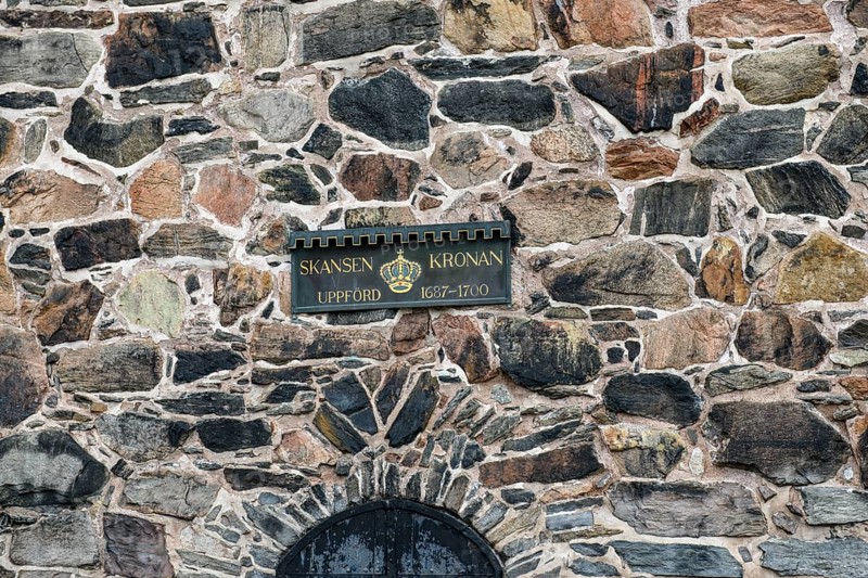 Detail of an old stone wall in Gothenburg's Skansen Kronan fortress with historic signs, rustic masonry, Gothenburg, Västra Götalands län, Sweden