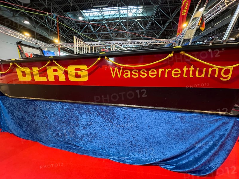 Press photo of DLRG Water Rescue logo on MRB fixed hull motor lifeboats by Deutsche Lebens-Rettungs-Gesellschaft e.V. during presentation at Messe Boot Düsseldorf, North Rhine-Westphalia, Germany