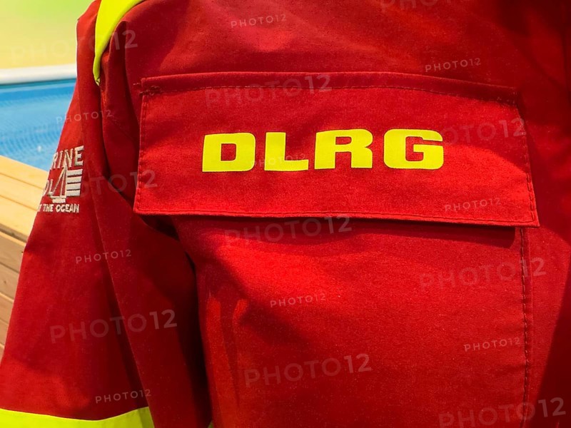 Press photo of DLRG logo on combat clothing from Deutsche Lebens-Rettungs-Gesellschaft e.V., Germany