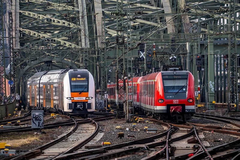 Rail system in front of Cologne Central Station, Hohenzollern Bridge across the Rhine, RRX, Rhine-Ruhr Express, regional train, regional trains, in front of the railway bridge, Cologne, North Rhine-Westphalia, Germany