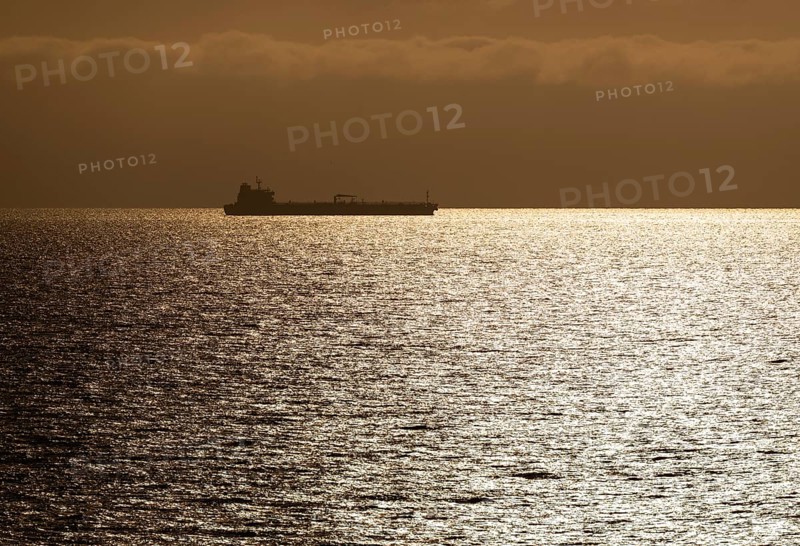 Silhouette, cargo ship, evening light, Baltic Sea