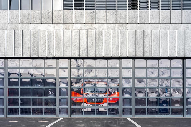 Fire department, fire station, modern guard, silver façade, glass gates, emergency vehicle, fire and rescue station 10, Gummersbacher Straße, Cologne, North Rhine-Westphalia, Germany