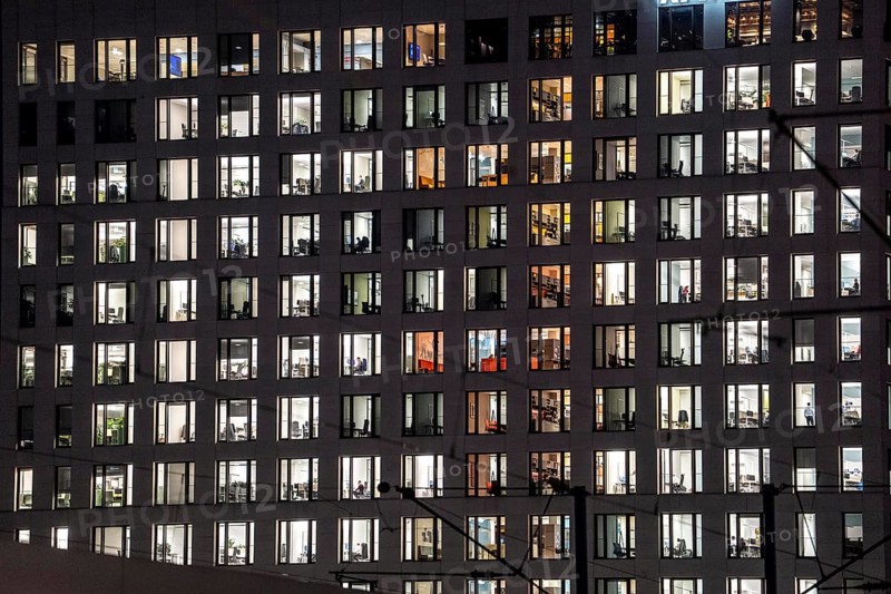 Office building, many windows are illuminated, Cologne, North Rhine-Westphalia, Germany