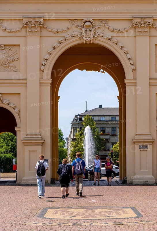 View through the Brandenburg Gate to the fountain on Luisenplatz, Potsdam, Brandenburg, Germany