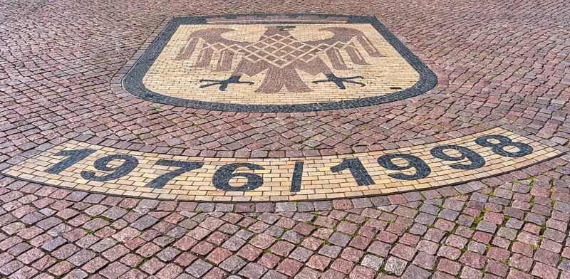 Brandenburg coat of arms on paving stone, sidewalk in front of the Brandenburg Gate in Potsdam, Brandenburg, Germany