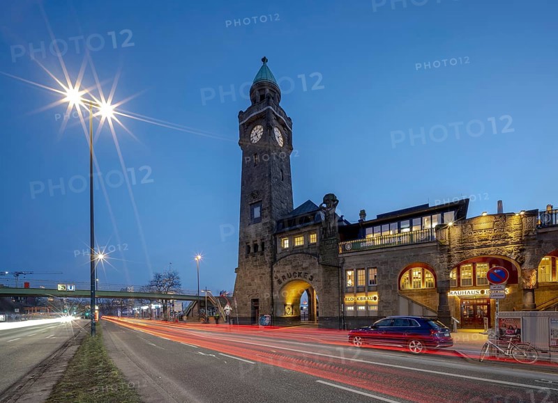 Hamburg piers with water level tower at night and traffic light trails, Hamburg, Germany