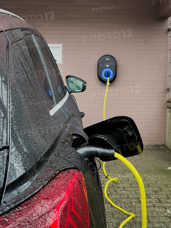An e-car is charged at a wallbox, Wuppertal, Germany