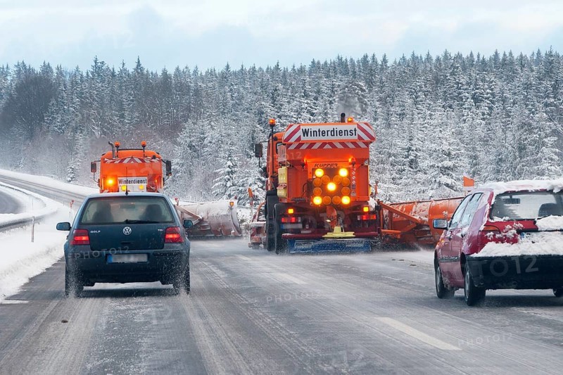 Winter maintenance, snowplow, spreader on snowy highway, Upper Bavaria, Germany