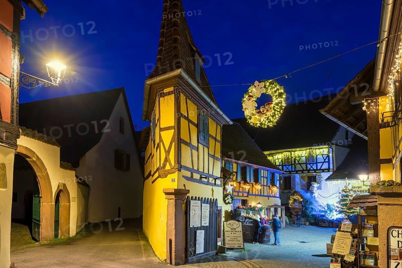 Houses illuminated and decorated for Christmas, Christmas market, blue hour, Eguisheim, Haut-Rhin department, Grand Est region, Alsace, France