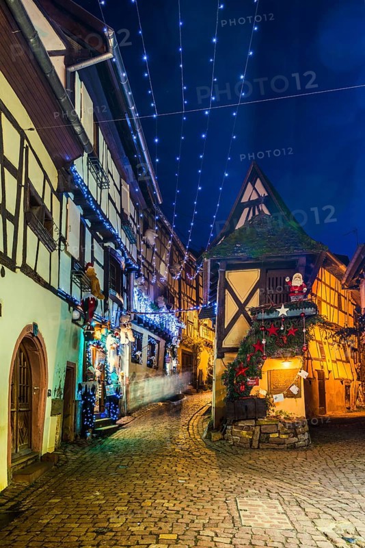 Houses illuminated and decorated for Christmas, Christmas market, blue hour, Eguisheim, Haut-Rhin department, Grand Est region, Alsace, France