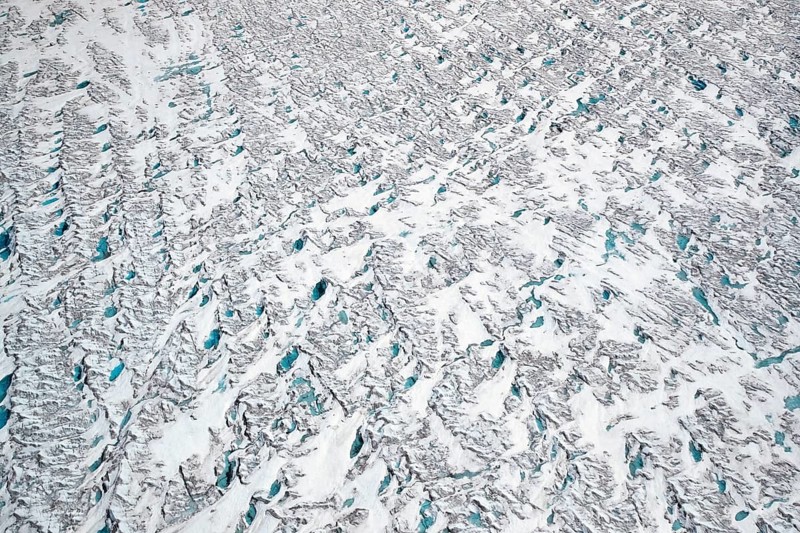Aerial view of meltwater on the Greenland ice sheet, Arctic landscape, frozen wilderness, glaciers and snow-covered terrain, Climate change, Global warming, Greenland, North America