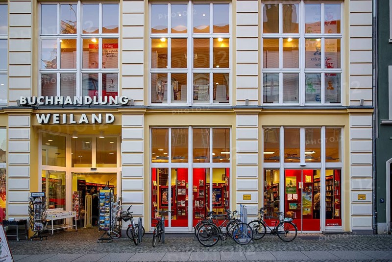 Weiland bookstore with bicycles parked in front of it, at the fish market in the Hanseatic City of Greifswald, Mecklenburg-Western Pomerania, Germany, for editorial use only
