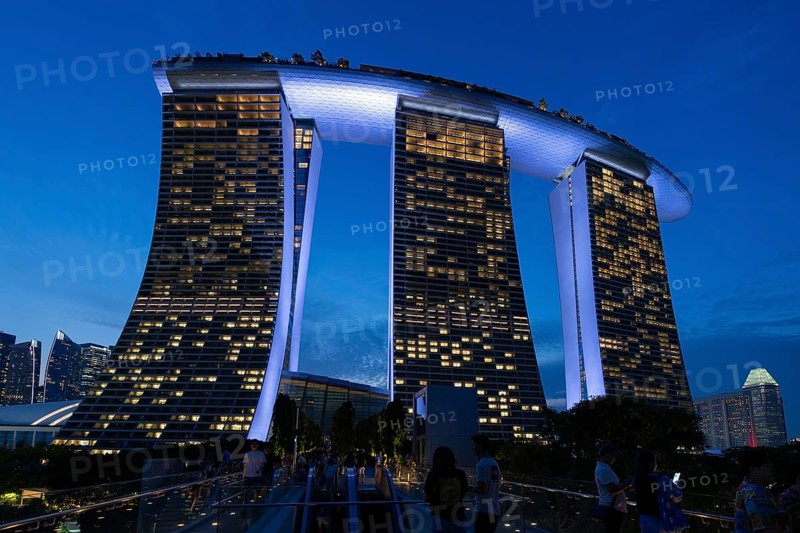 Marina Bay Sands, MBS, luxury 5-star hotel and integrated resort illuminated at dusk in Downtown Core of the city Singapore, Southeast Asia