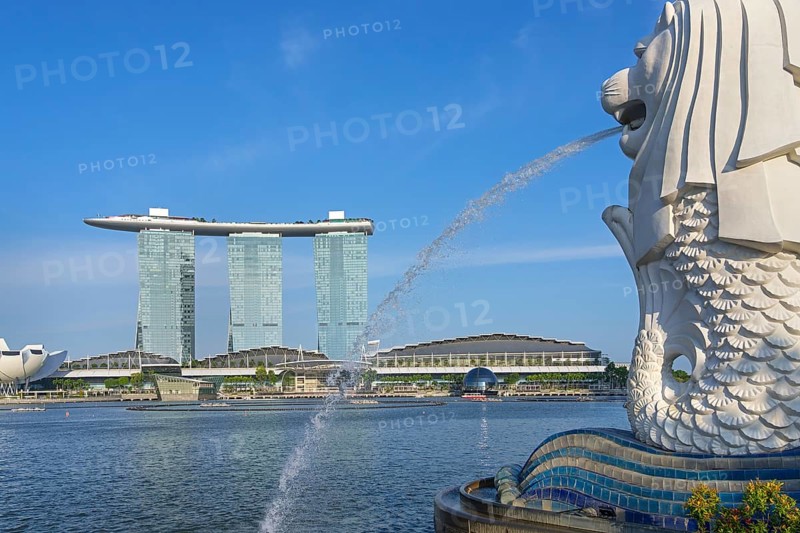 The Merlion fountain and Marina Bay Sands, MBS, luxury 5-star hotel and integrated resort in Downtown Core of the city Singapore, Southeast Asia