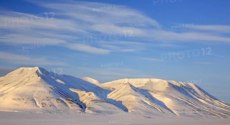 Snow covered mountain Operafjellet, Opera Mountain on the north side of Adventdalen near Longyearbyen in spring, Spitsbergen, Svalbard, Norway