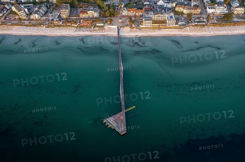 Aerial view over Seebrücke, pier and sandy beach at seaside resort Scharbeutz along the Baltic Sea, Ostholstein, Schleswig-Holstein, Germany