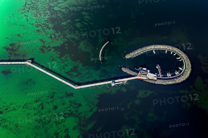 Aerial view over Seebrücke, pier and marina with boats at seaside resort Prerow along the Baltic Sea, Darß, Fischland, Mecklenburg-Vorpommern, Germany