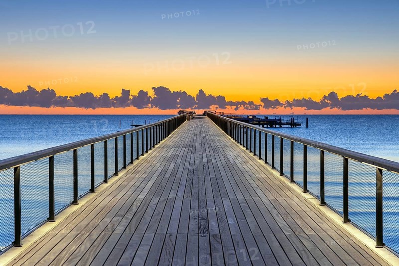 Seebrücke, pier with wooden deck made of azobe, bongossi hardwood at seaside resort Scharbeutz along the Baltic Sea, Schleswig-Holstein, Germany
