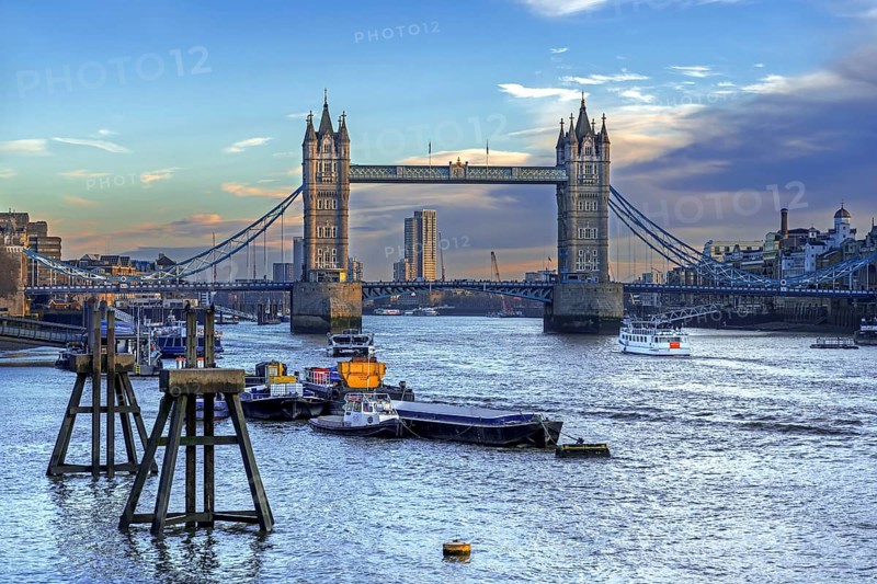 19th century Tower Bridge, neo-Gothic bascule / suspension bridge crossing the River Thames in the capital city London, England, UK