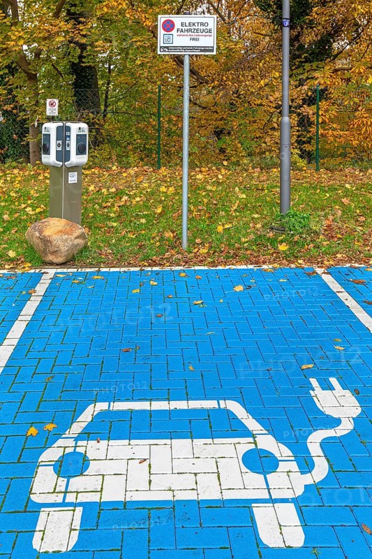 Parking area with empty public charging station / loading point from KEBA, network of chargers for electric vehicles / cars in Lower-Saxony, Germany