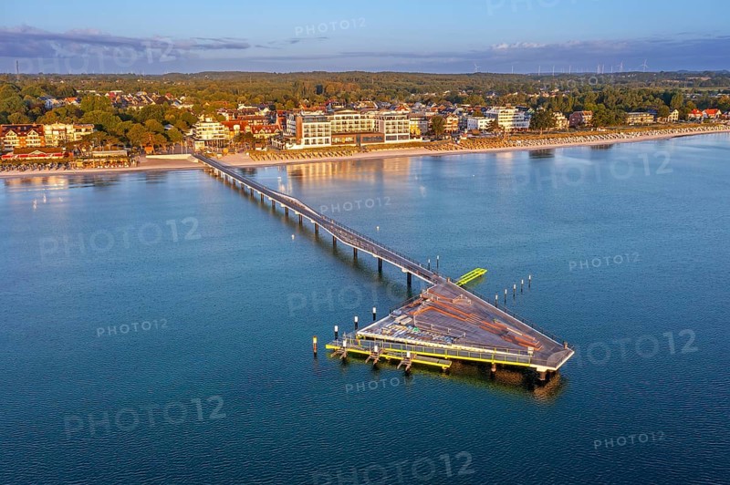 Aerial view over Seebrücke / pier and sandy beach at seaside resort Scharbeutz along the Baltic Sea, Ostholstein, Schleswig-Holstein, Germany