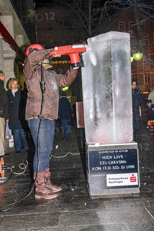 An ice sculpture is being created: ice carving street action as part of the long shopping night in the city center of Reutlingen, Baden-Württemberg, Germany, for editorial use only