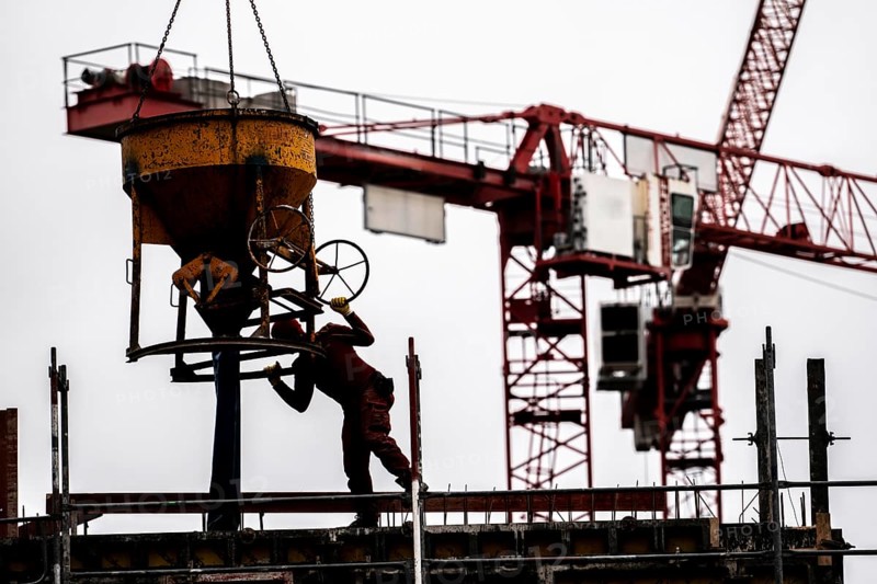 Construction site, concreting work, on a large construction project, apartments and commercial premises, symbolic image of the construction industry