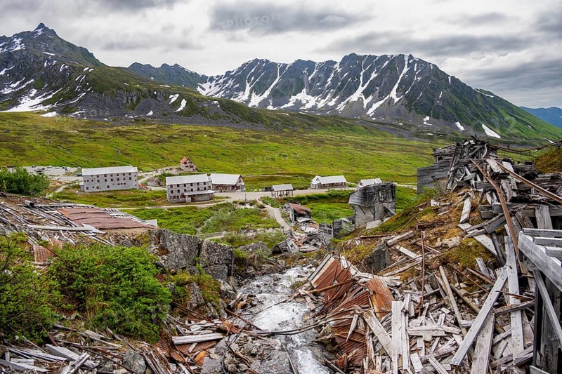 Crumbling mill and former Gold Mine Independence Mine building in mountainous landscape, Independence Mine State Historical Park, Hatcher Pass, Talkeetna Mountains, Alaska, USA
