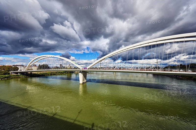 Beatus-Rhenanus bridge, pedestrian and tram bridge, architect Marc Barani, Rhine river, border between Germany and France, border river, rainy mood, partly cloudy blue sky, cumulus clouds, cumulus congestus clouds, image processing brightnesses and contrasts, Kehl, Upper Rhine plain, Ortenau district, Baden-Württemberg, Germany
