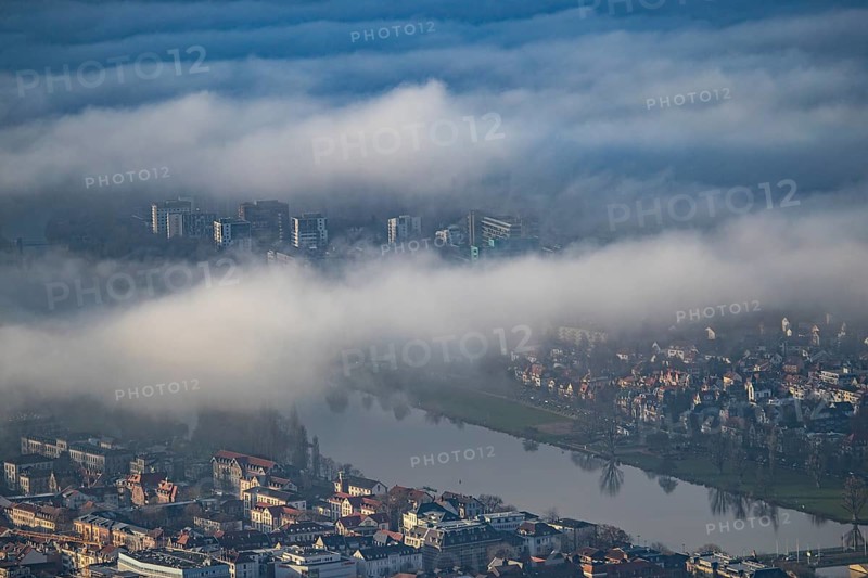 Aerial view of the city of Heidelberg on the Neckar, fog landscape of low-hanging clouds and fog fields floating and waving above the roofs of the city and the Neckar, Heidelberg, Baden-Württemberg, Germany