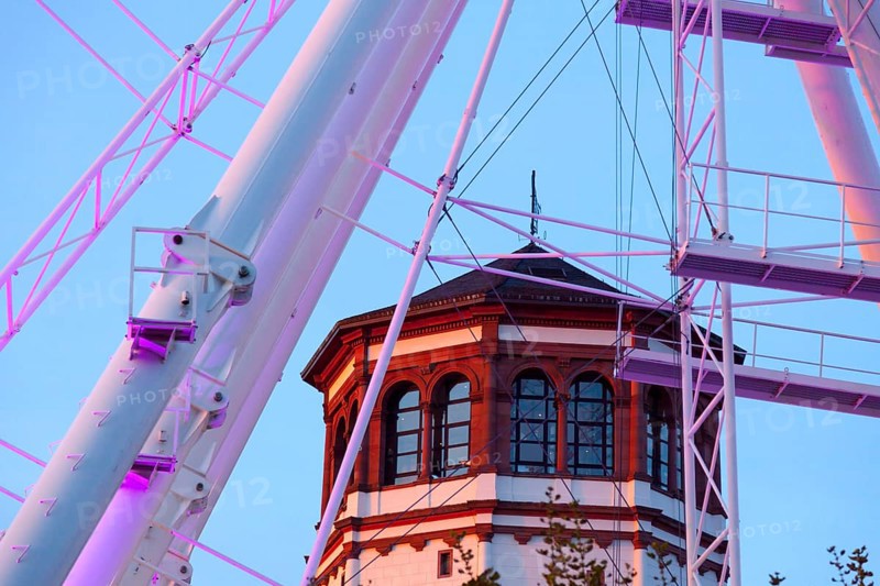 Rhine promenade with illuminated Ferris wheel and castle tower at dusk, Düsseldorf, North Rhine-Westphalia, Germany