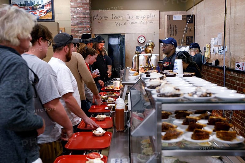 People stand in line at Arnold's Country Kitchen in Nashville, Nashville, Tennessee, USA