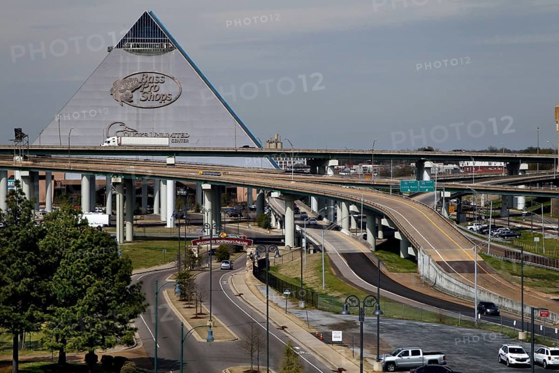 Futuristic pyramid next to a complex network of roads and bridges, Memphis, Tennessee, USA