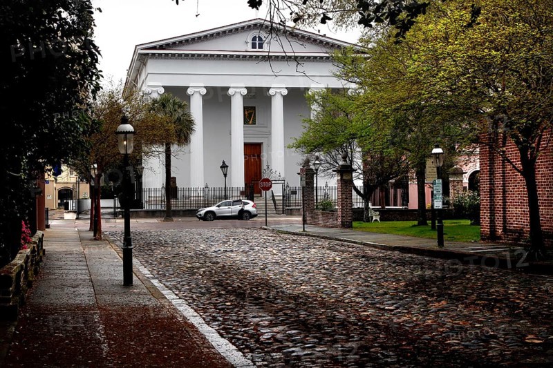 Historic building with pillars on a paved street in Charleston, Charleston, South Carolina, USA