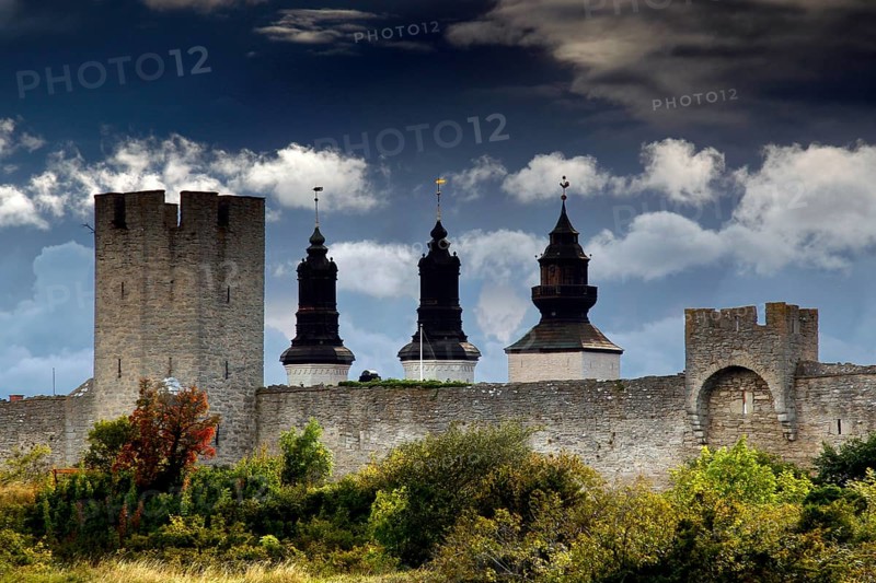 Medieval city wall of Visby with towers and dramatic sky, Visby, Gotland, Sweden