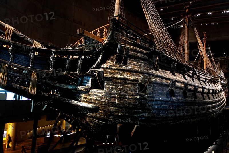 The royal flagship Vasa in the Vasa Museum presents its impressive wooden structure in low light, Stockholm, Djurgården, Sweden