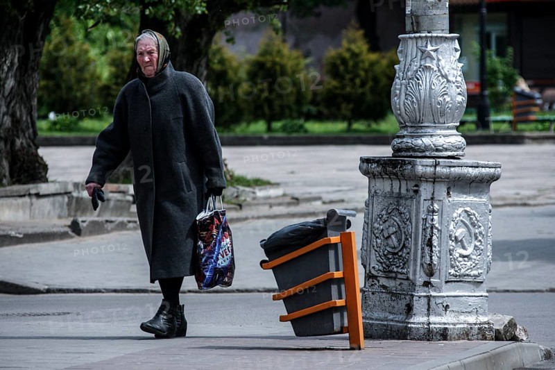 Old man walking across a street in Tilsit, Sovetsk, Tilsit, Russia