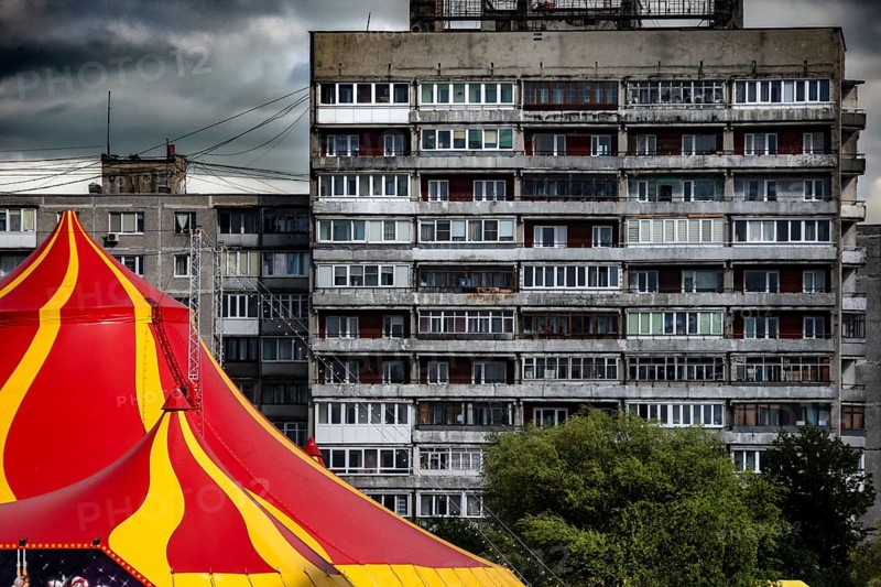 An eye-catching circus tent stands in front of a dominating prefabricated building, Kaliningrad, Kaliningrad, Russia