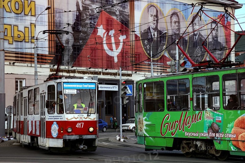 Colourful trams in front of Soviet propaganda posters, Kaliningrad, Russia