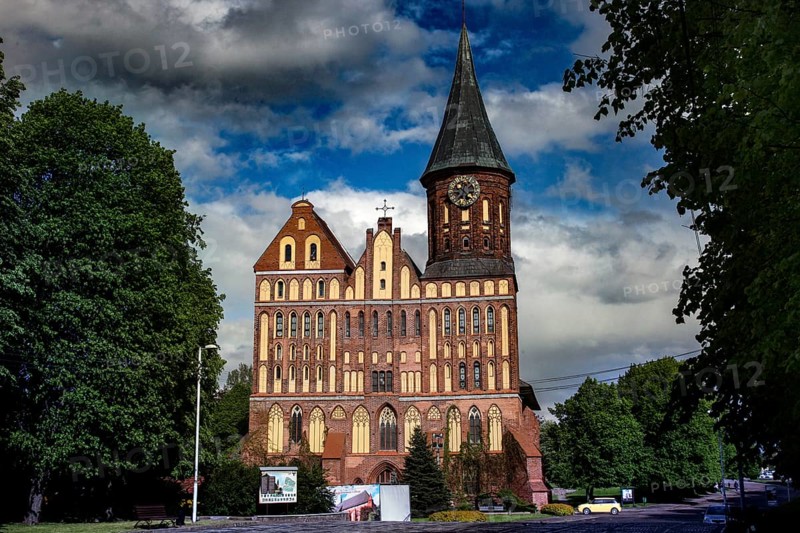 Majestic cathedral with impressive tower against blue sky, Kaliningrad, Russia