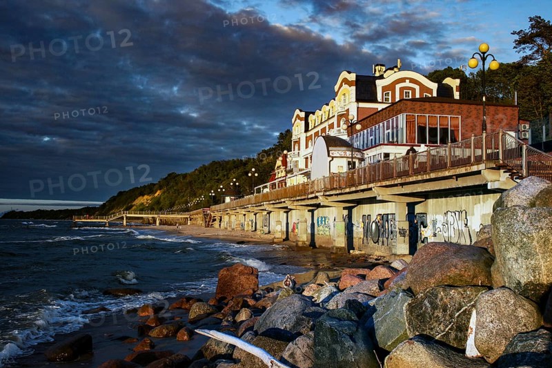 Promenade on the beach at dusk with coastal houses, Svetlogorsk, Kaliningrad, Russia