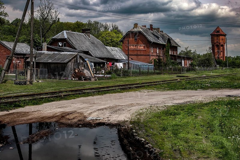 Historic train station in a quiet rural setting with dramatic skies, Cistye Prudy, Kaliningrad, Russia