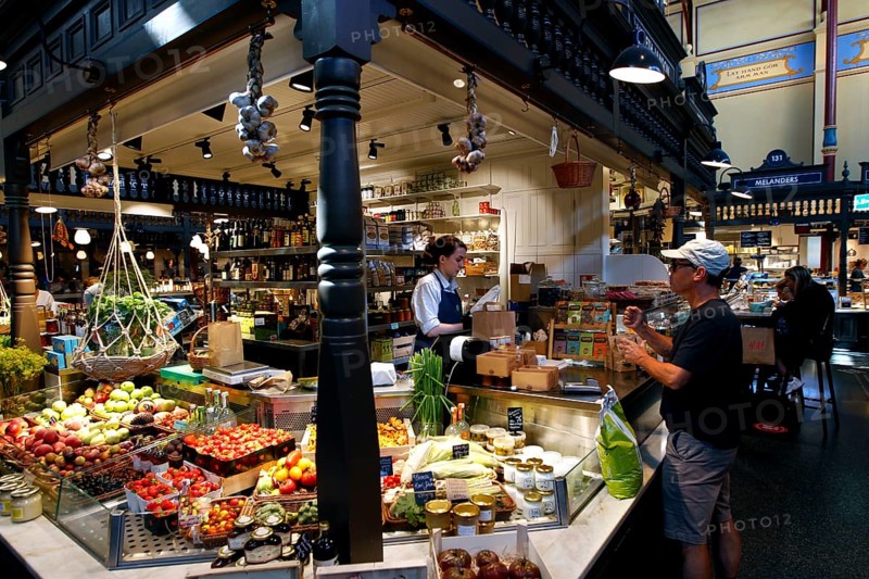 Lively market hall in Östermalm with a variety of food stalls and hustle and bustle, Stockholm, Östermalm, Sweden