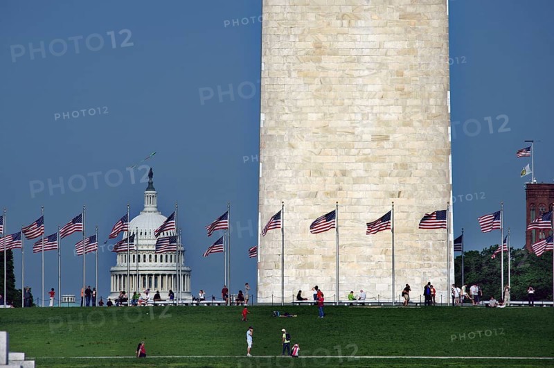 Washington Monument with flags and the Capitol in the background, Washington D.C, USA