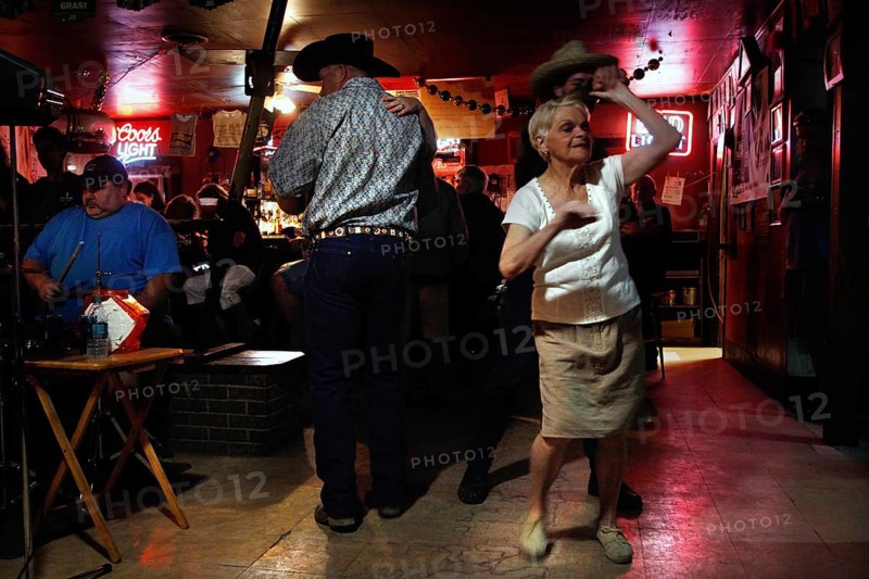 An elderly dancer dances in Fred's Lounge, Mamou, Louisiana, USA