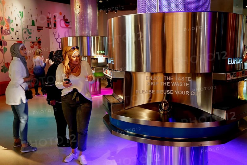 Visitors to the Coca-Cola Museum tasting room in Atlanta enjoy the colorful selection, Atlanta, USA