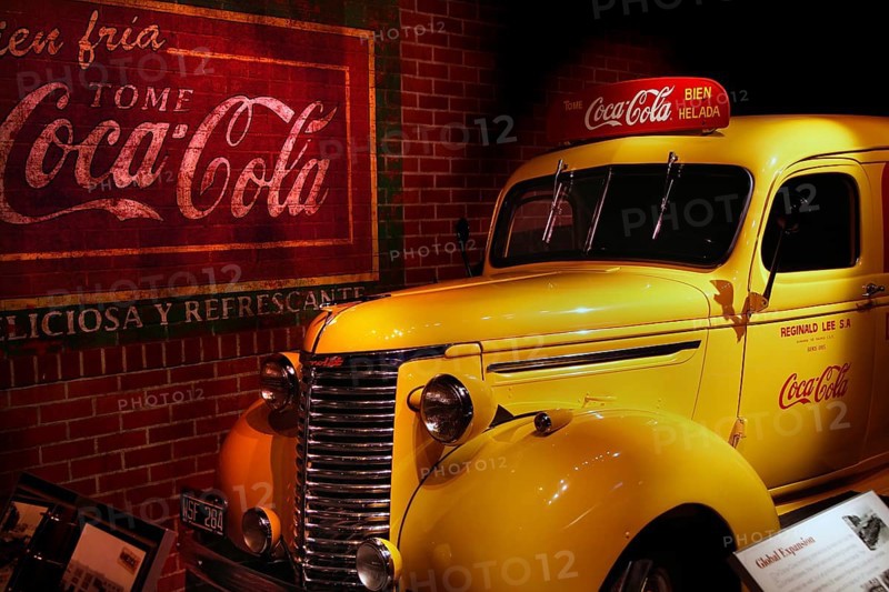 A retro yellow Coca-Cola car is presented nostalgically at the museum in Atlanta, Atlanta, Georgia, USA